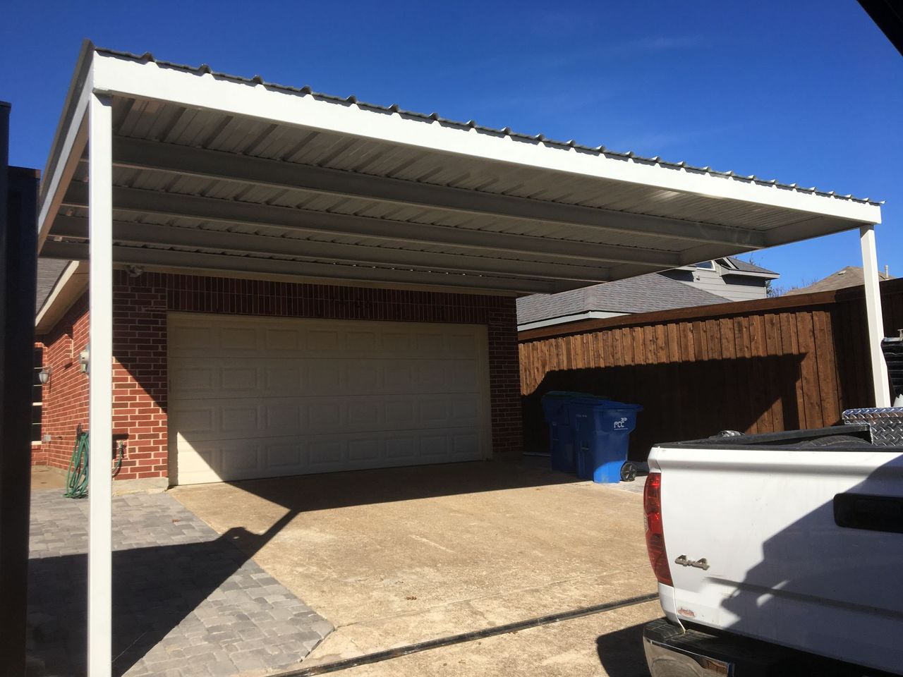 Attached carport extending from a home's roofline