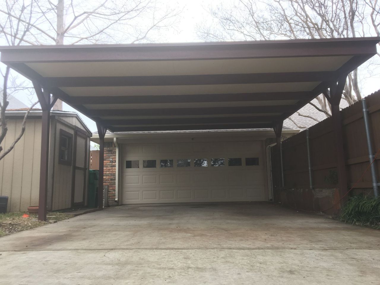 Carport installation protecting a vehicle